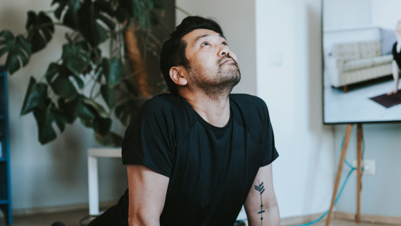 man performing yoga